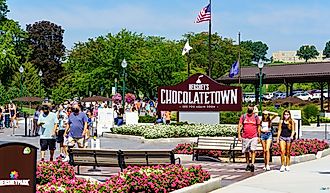 Visitors arriving at the entrance of Hersheypark, a popular attraction in Chocolatetown USA. Editorial credit: George Sheldon / Shutterstock.com