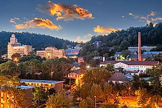 Townscape of Hot Springs, Arkansas, at dusk, set in the mountains.