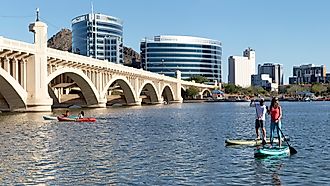 Paddle boarders and kayakers on Tempe Town Lake, Tempe, Arizona, via Cavan-Images / Shutterstock.com