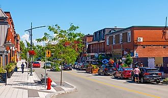 Historic commercial buildings on Rue Principale O Street in downtown Magog, Quebec QC, Canada. Editorial credit: Wangkun Jia / Shutterstock.com