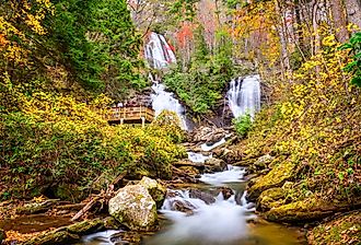 Anna Ruby Falls, Georgia, with tourists in autumn.