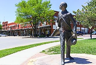 Bronze sculpture of Wyatt Earp as part of the Trail of Fame in the historic district of Dodge City, Kansas. Image credit Michael Rosebrock via Shutterstock