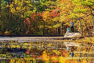 Oklahoma, NOV 6, 2021 - People seeing the nature autumn fall color of Robbers Cave State Park. Editorial Credit: Kit Leong via Shutterstock.