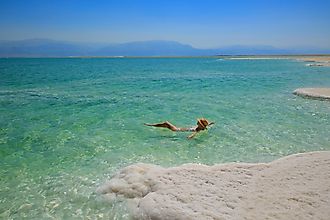 A woman floating in the Dead Sea.