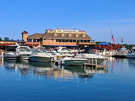 Put-in-bay, Ohio: Boats tied up at A-Dock with the famous Boardwalk restaurant in the background, via LukeandKarla.Travel / Shutterstock.com