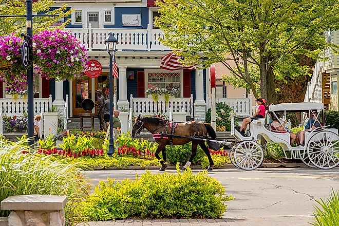 A horse-drawn carriage transports tourists in downtown Frankenmuth, Michigan. Image credit arthurgphotography via Shutterstock.com