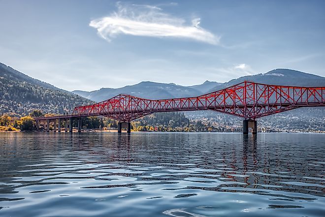 Big Orange Bridge over Kootenay River with Nelson, British Columbia in the background