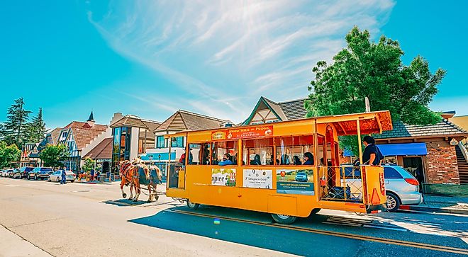 Horse driven cab in Solvang, picturesque small town in Santa Barbara County, California. Popular touristic attraction, street view