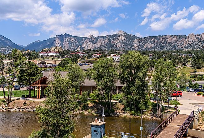 Estes Park, a sunny Summer day view of the center of the mountain resort town along Big Thompson River, Colorado.