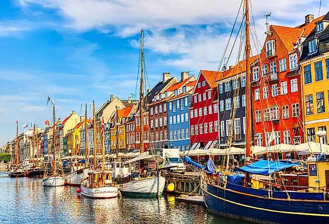 Copenhagen iconic view of the old Nyhavn port during a summer sunny day.