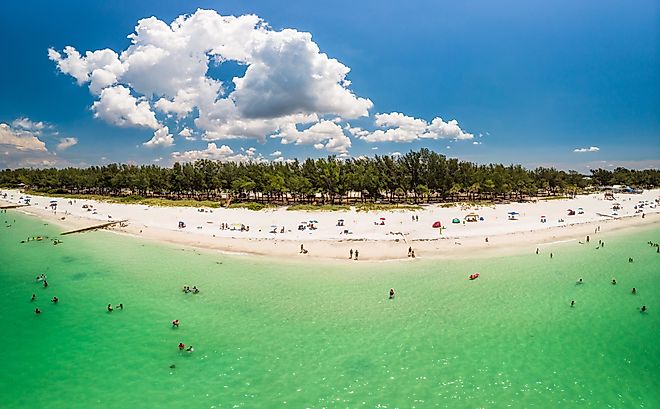 Aerial view of Anna Maria Island, white sand beaches and blue water, barrier island on Florida Gulf Coast. Image credit Unwind via Shutterstock