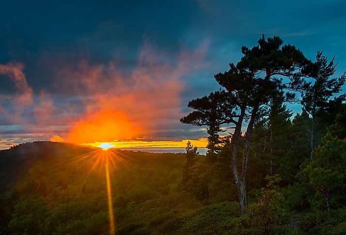 Spectacular sunset through the clouds at Porcupine Mountains Wilderness Area in Michigan.