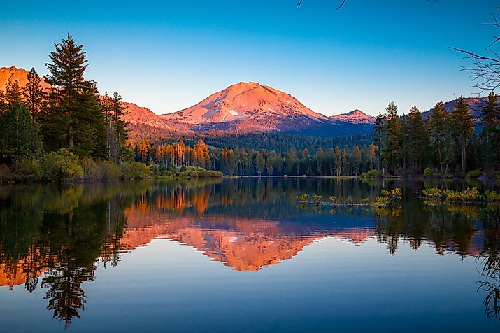 Sunset at Lassen Peak with reflection on Manzanita Lake, Lassen Volcanic National Park, California. 