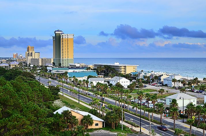 Cityscape of Panama City Beach, Florida, along Front Beach Road at dusk.