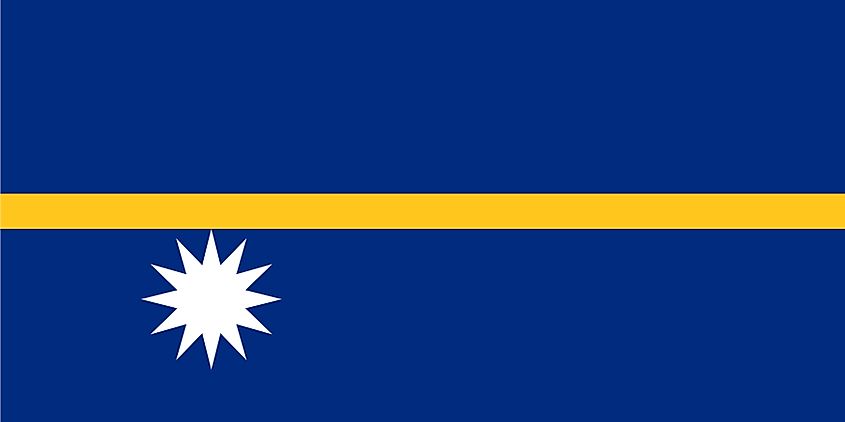 The National Flag of Nauru features a blue background with a narrow, horizontal gold stripe and a white star in the lower hoist side