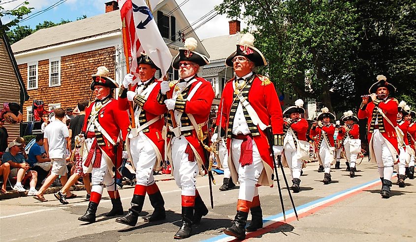 Adults dressed in British red coats from the American Revolution in Bristol, Rhode Island.