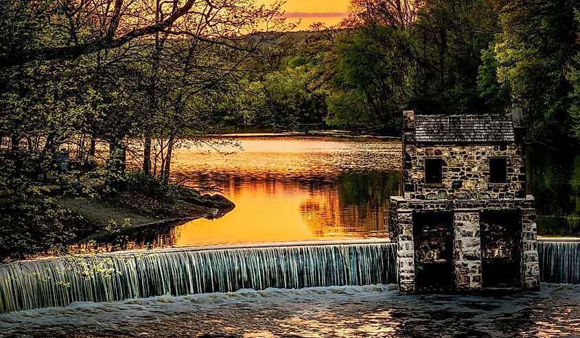 Historic Speedwell Dam and Lake at sunset in Morristown, New Jersey. Image credit Brian Logan Photography via Shutterstock