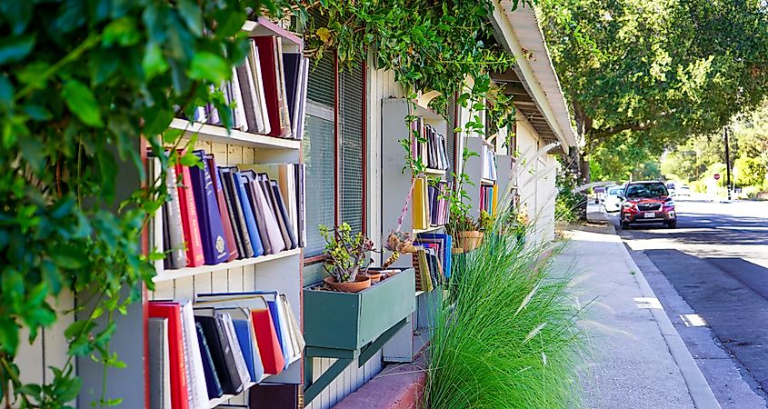 Barts Bookstore in Ojai, California, featuring shelves of books placed outside the building along the street.