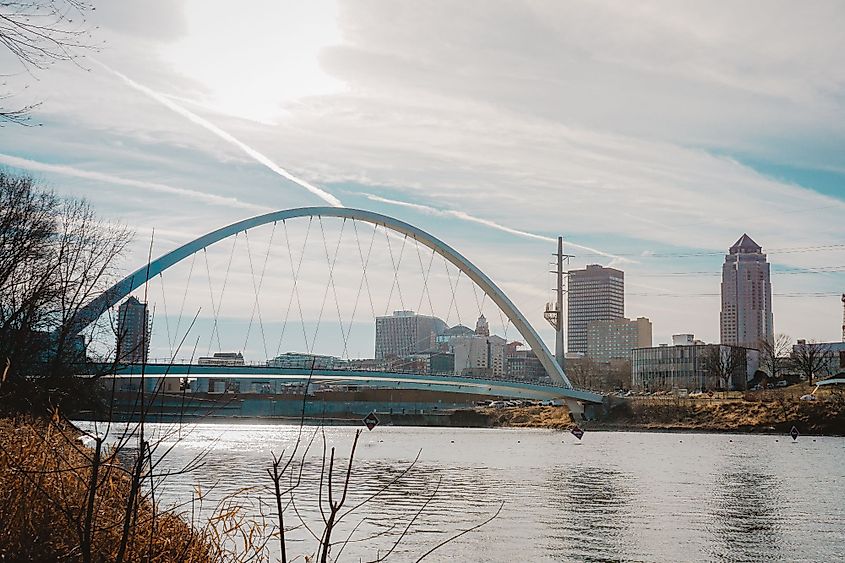 A view of downtown Des Moines and the Iowa Women of Achievement Bridge from the banks of the Des Moines River in Des Moines, Iowa. 