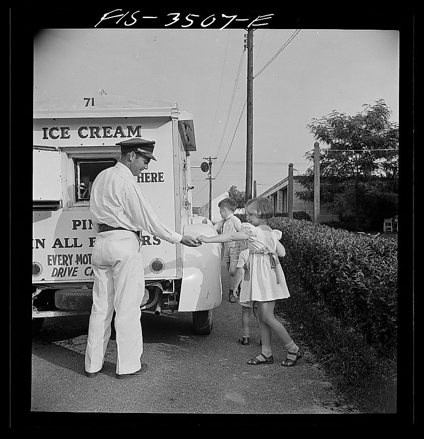 Ann Atkins buying ice cream from the Good Humor man in Greenbelt, Maryland. Image Credit Marjory Collins via Wikimedia.