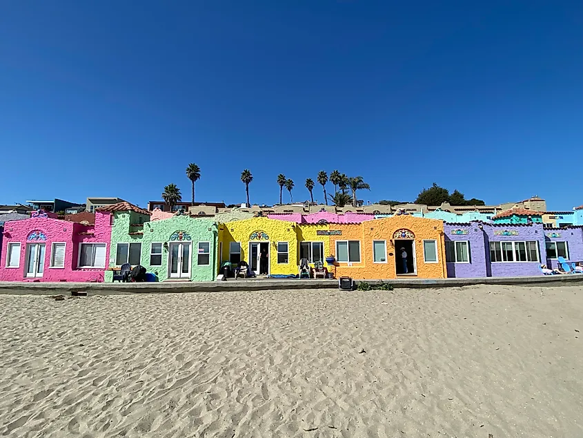 A series of brightly colored beachside accomodations comprising the Capitola Venetian Hotel in California