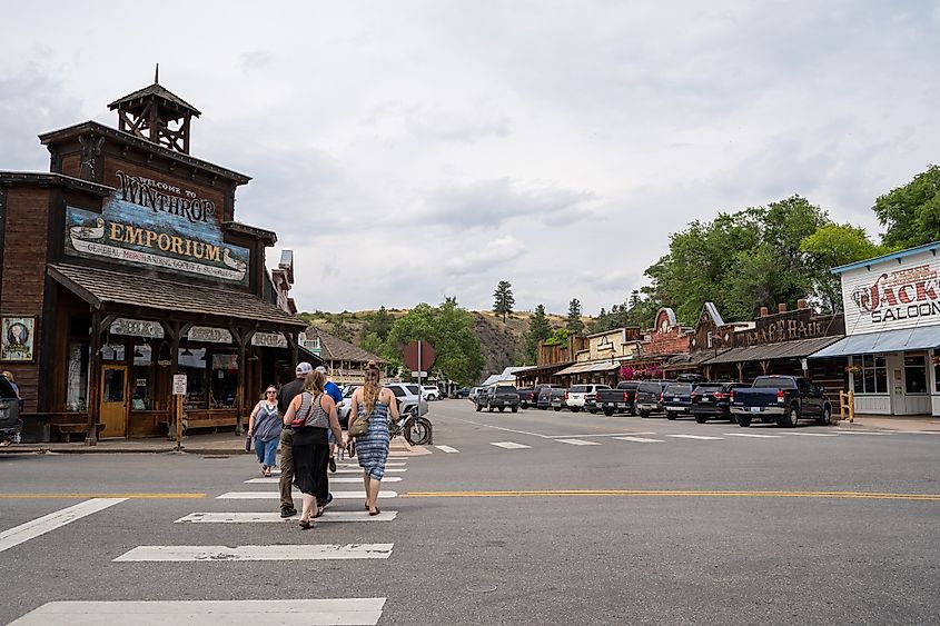 Wild West themed buildings along a lively street in Winthrop, Washington.