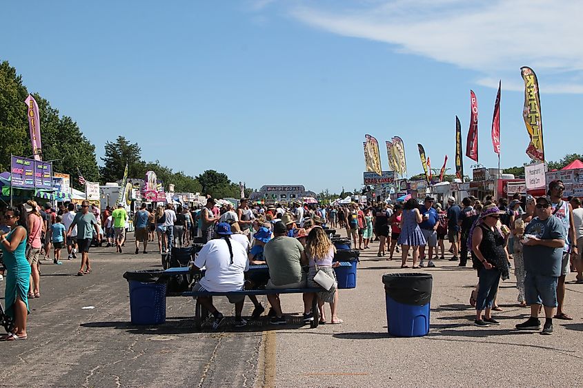 Seafood festival at Ninigret Park in Charlestown, Rhode Island, featuring various stalls and attendees enjoying the event.