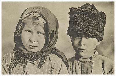 Two Russian peasant children looking at camera