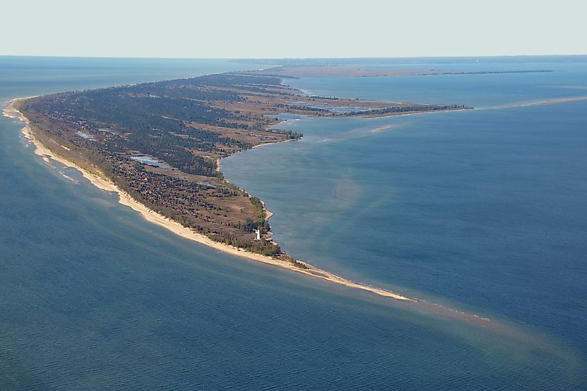 Long Point National Wildlife Refuge with red-topped Long Point Lighthouse near its far eastern tip