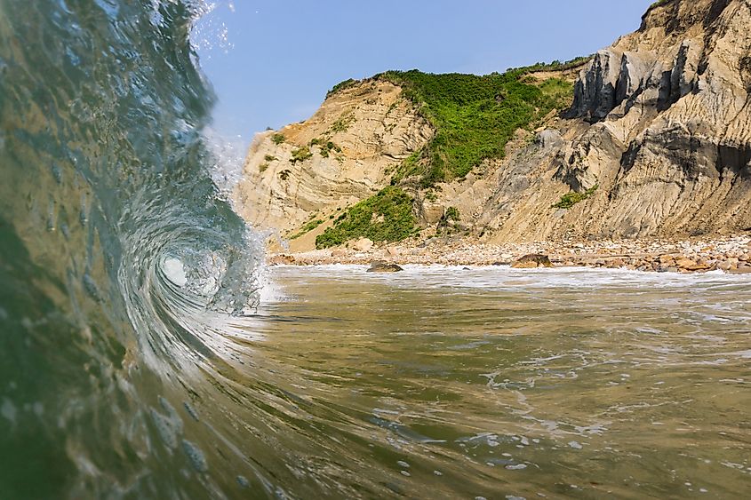 A wave barrels along before crashing onto the shore at Block Island, Rhode Island.