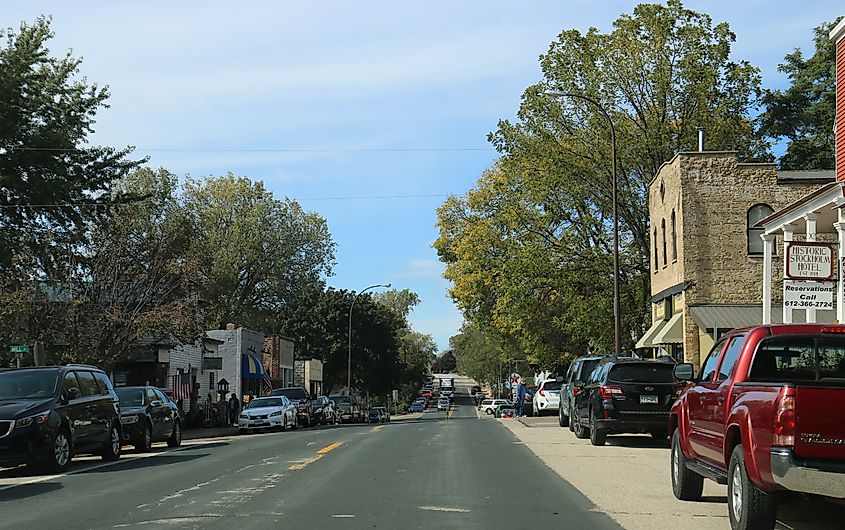 Downtown Stockholm, Wisconsin, featuring quaint shops, art galleries, and historic buildings, set along tree-lined streets.