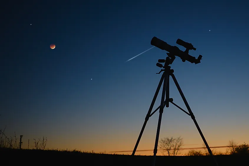 An astronomy telescope pointed at the night sky
