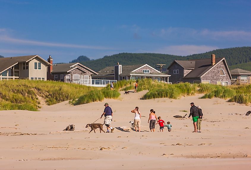 People on beach on Oregon coast, via Rob Crandall / Shutterstock.com