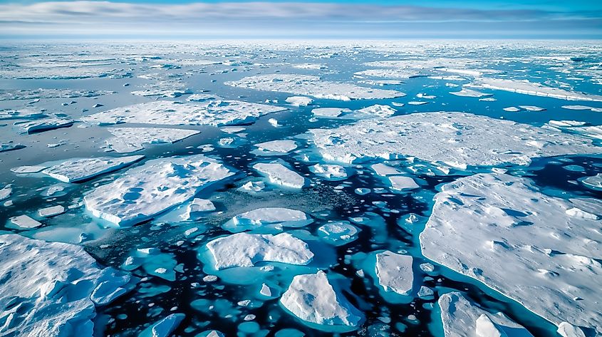 A stark landscape of the North Pole, where climate change has caused melting ice caps and a significant reduction in polar ice extent.