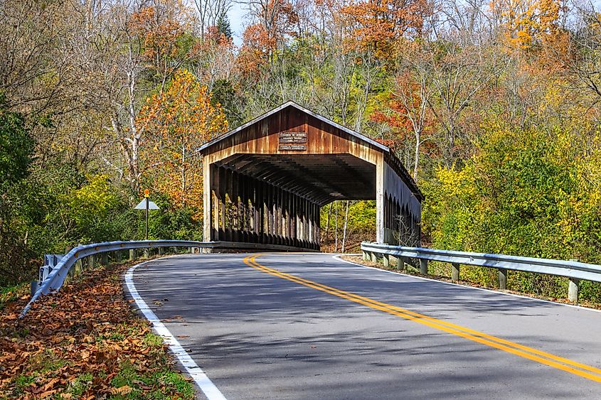 The picturesque Corwin M. Nixon covered bridge over the Little Miami River on an autumn day at Waynesville, Ohio