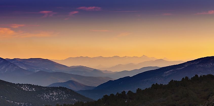 Mountain ranges at sunset receding in layers into the distance. View is from Rowe Peak near Dayton, Nevada.