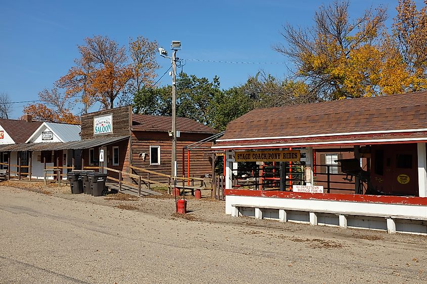 Saloon and stagecoach ride along Louis L'Amour Lane in Frontier Village, Jamestown, North Dakota.