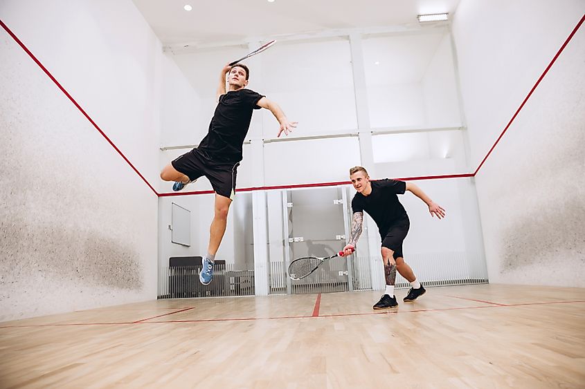 Two men playing squash