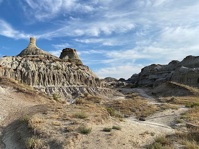 A dramatic landscape of hoodoos and striated badland canyons.  