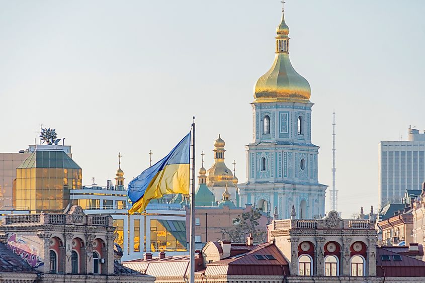 The main symbols of Ukraine - Ukrainian flag and the temple of the Ukrainian Orthodox Church.