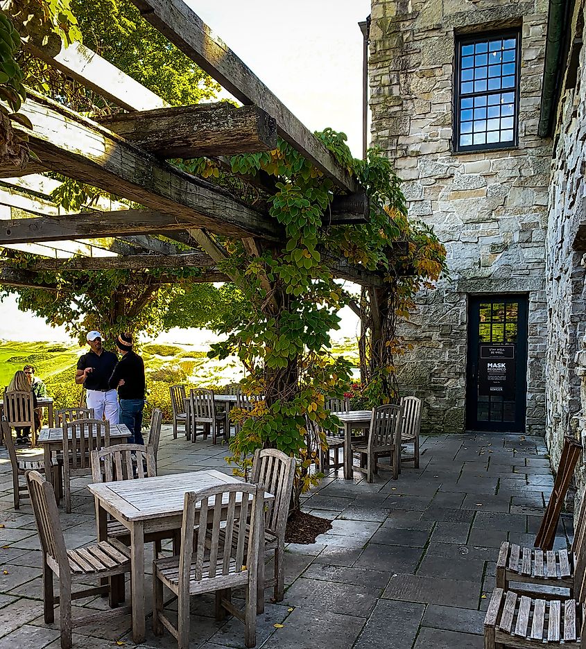 Landscape photo of clubhouse courtyard at Whistling Straits golf club on a beautiful summer day. Editorial credit: PiXel Perfect PiX / Shutterstock.com