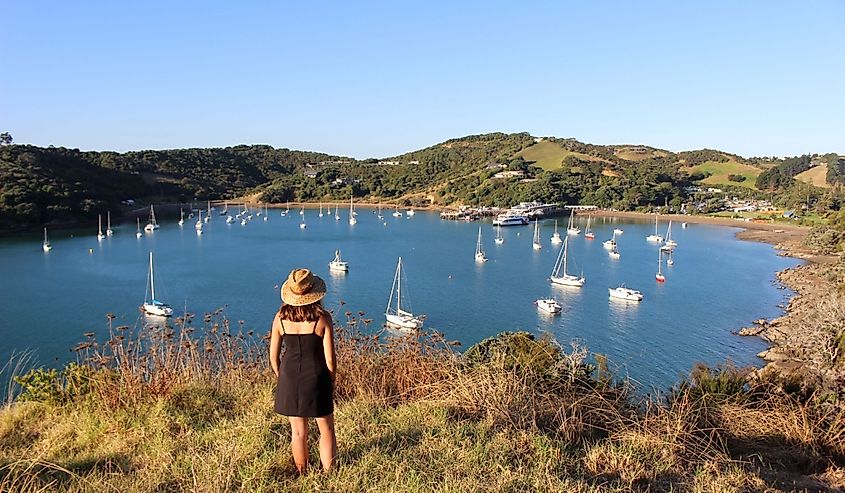 Girl looking at Matiatia Bay in Waiheke Island, a ferry ride away from Auckland