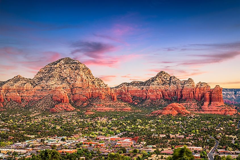Aerial view of Sedona, Arizona, with the red rock formations in the backdrop.