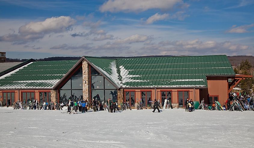 People standing outside the lodge at the Wisp Ski Resort located in McHenry, Maryland