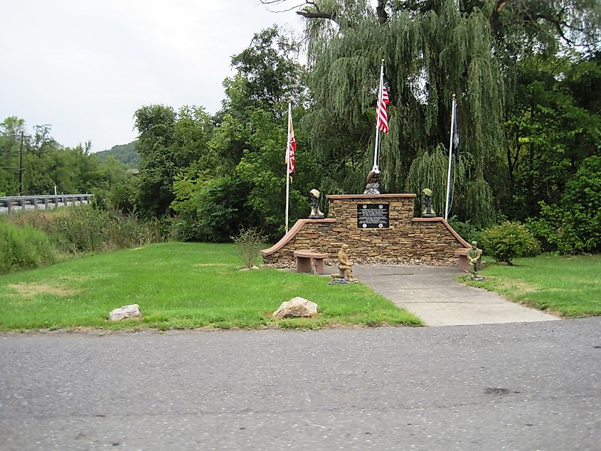 War memorial in Flintstone, Maryland, honoring local veterans with engraved names and patriotic symbols.