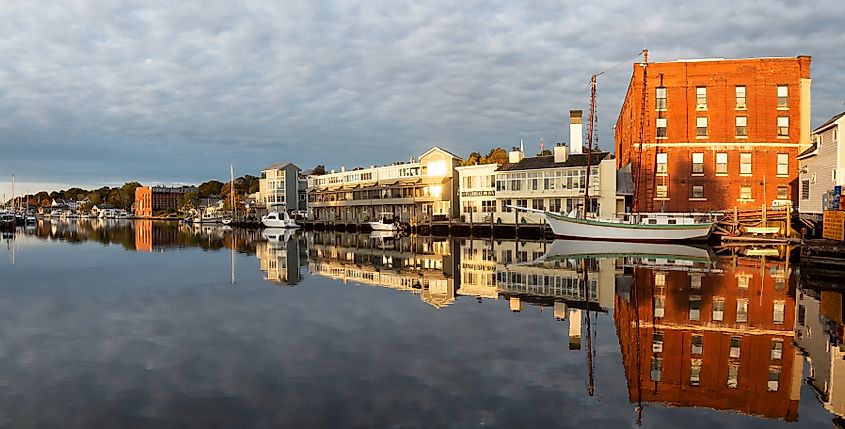 Panoramic view of historic homes along the Mystic River during a vibrant sunrise in Mystic, Stonington, Connecticut.
