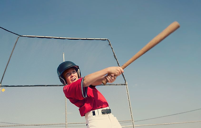 Young batter hitting the ball in a youth Baseball game,