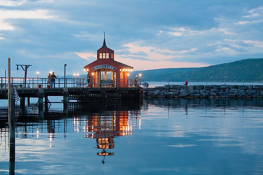 Watkins Glen - Pier on Seneca Lake with glowing lights at sunset. Editorial credit: Meagan Marchant / Shutterstock.com