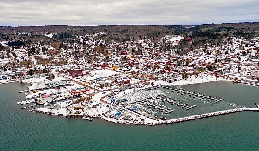 A beautiful fishing village of Bayfield Wisconsin has pancake ice and boats lifted out of the water for the winter season.