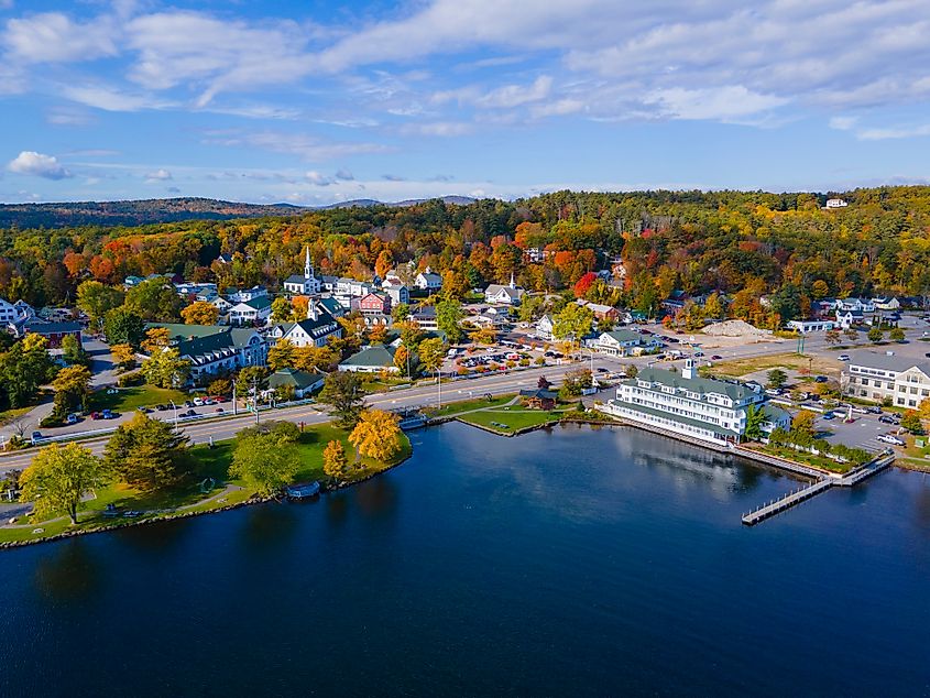 Meredith town center with fall foliage aerial view in fall with Meredith Bay in Lake Winnipesaukee, New Hampshire, USA.